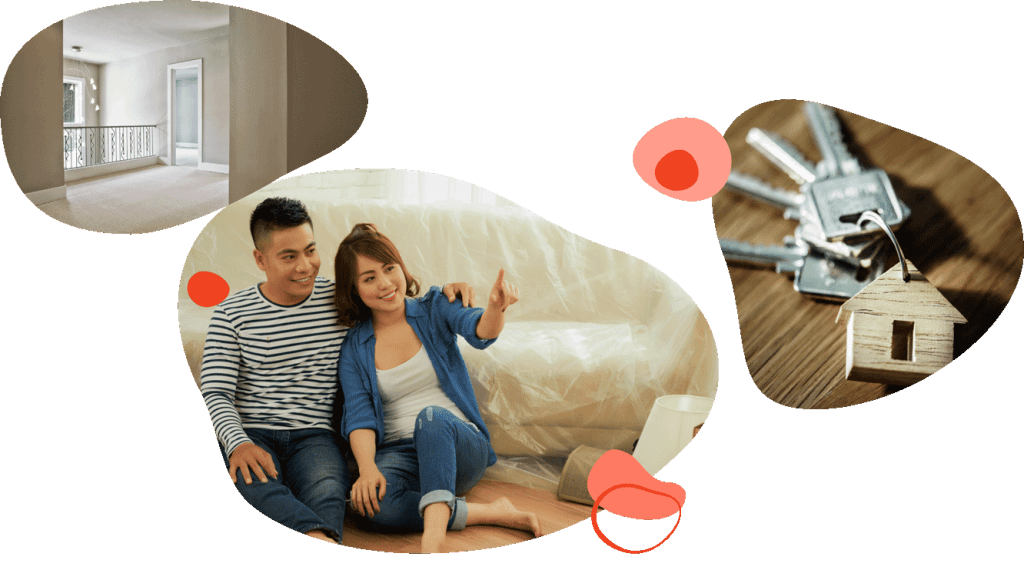 Young couple sitting on the floor of their new home, with house keys beside them
